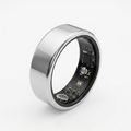 Silver smart ring with electronic components on a white background
