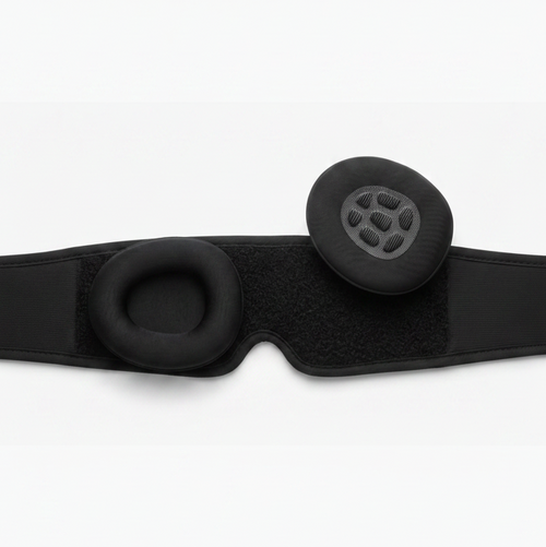 Black headband with two round cushions on a white background